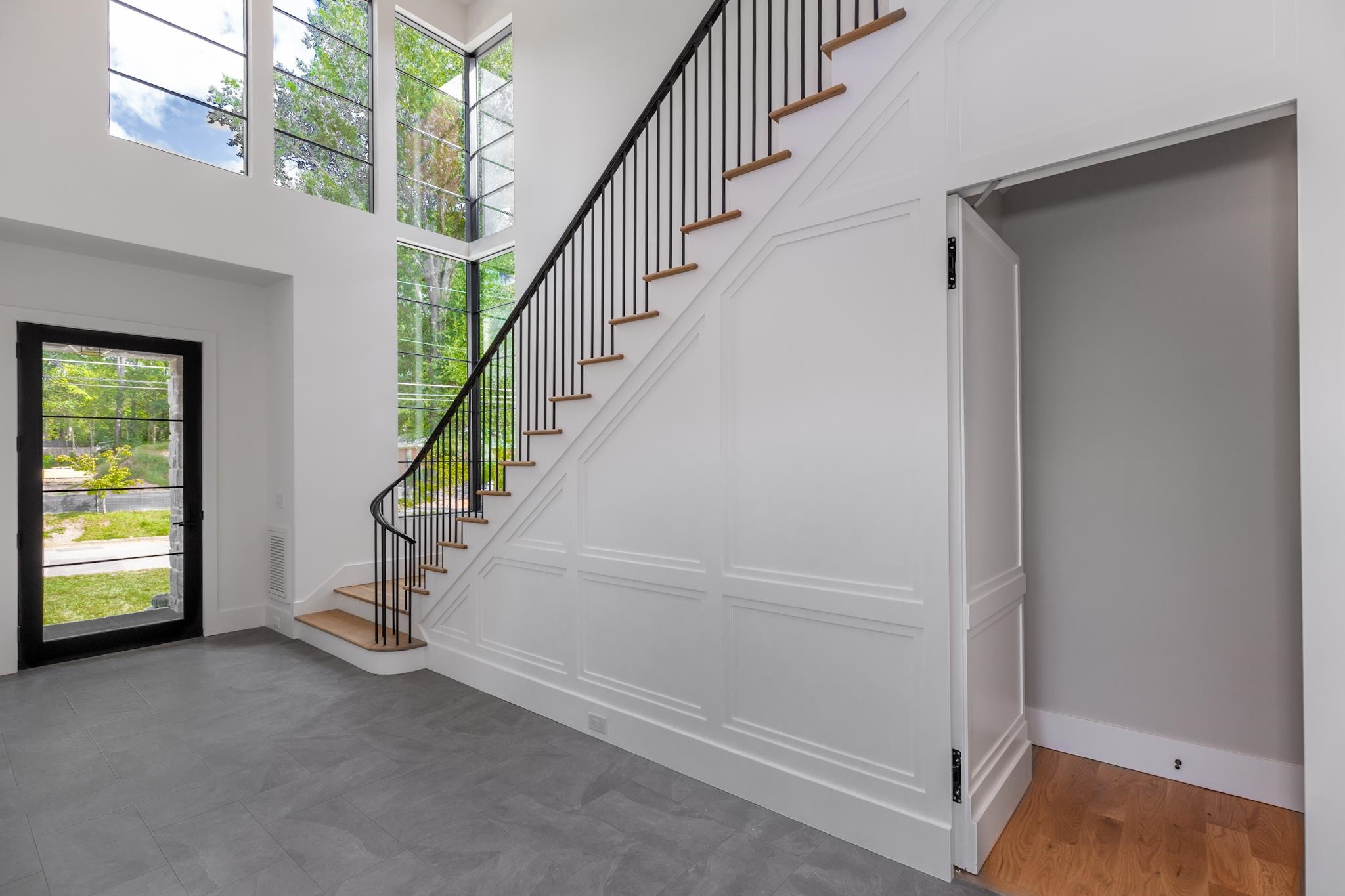 807 Chamberlain Street Raleigh, NC 27607 - Photo 6 of 40 a view of entryway with wooden floor and stairs