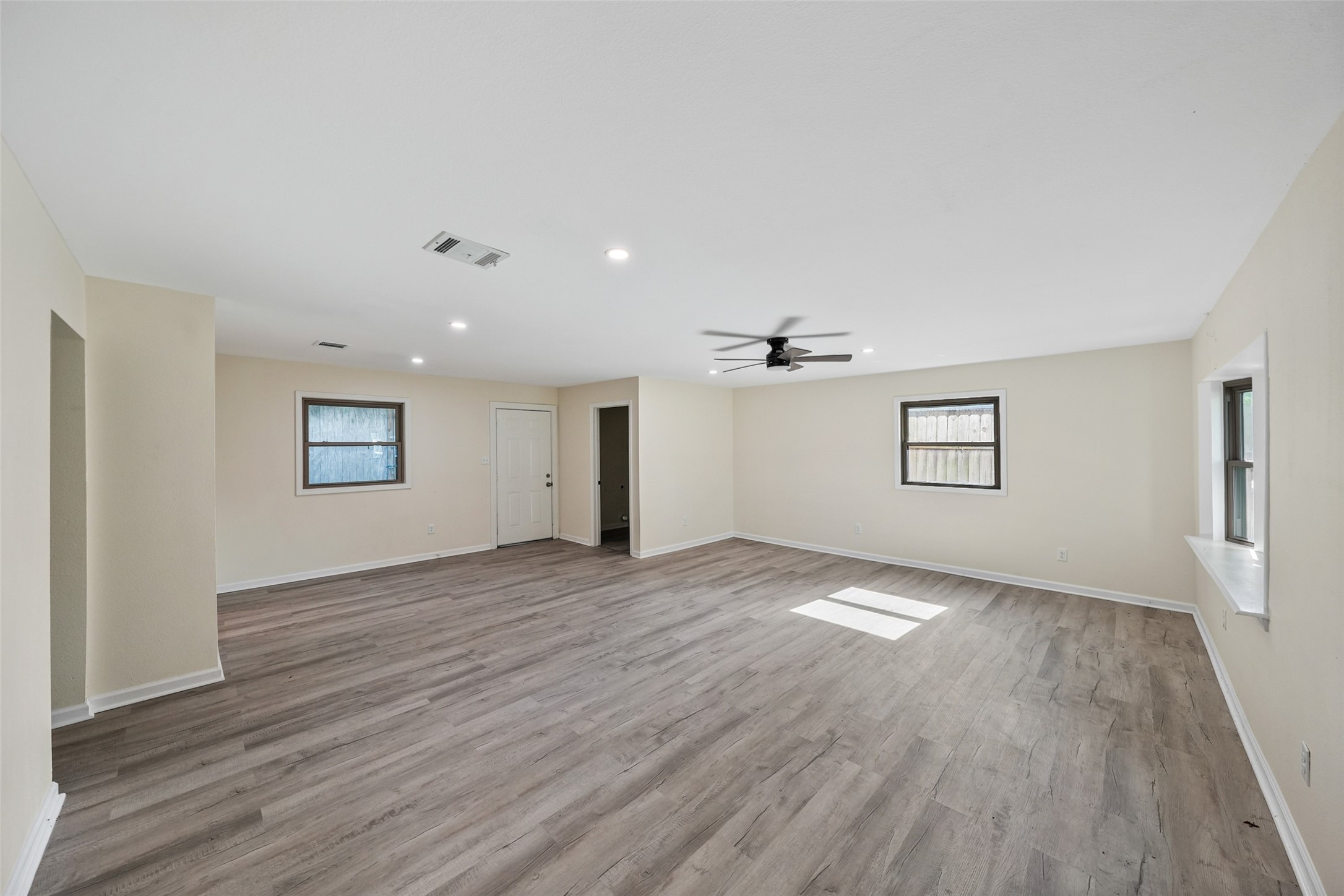 725 Lafayette Street Hempstead, TX 77445 - Photo 8 of 20 Spacious living room with luxury vinyl plank flooring and recessed lighting