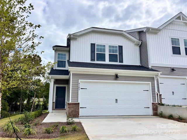 a front view of a house with garage