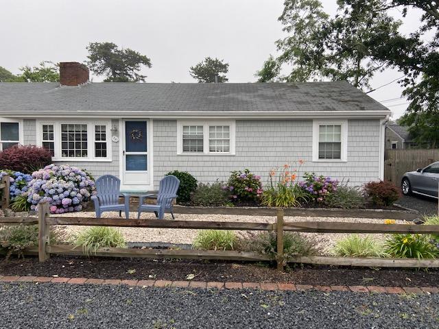 a front view of a house with a yard and a garage