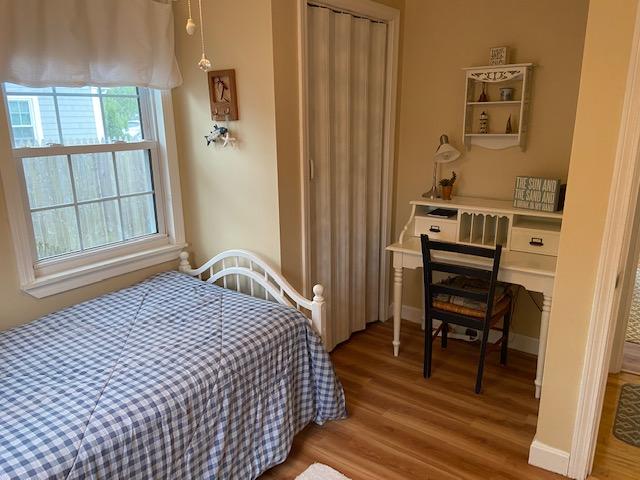 101 Lower County Road, Unit 2B Dennis Port, MA 02639 - Photo 11 of 28 a bedroom with a bed and a window