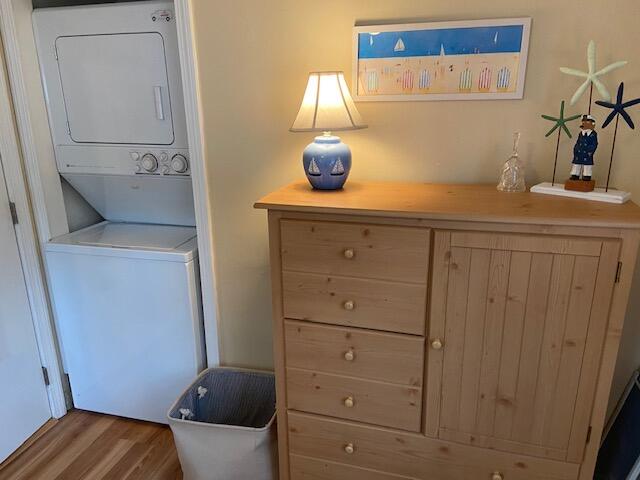 101 Lower County Road, Unit 2B Dennis Port, MA 02639 - Photo 12 of 28 a bedroom with a bed and cabinets
