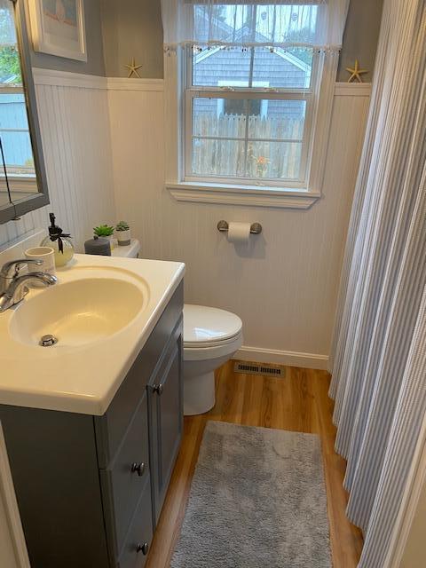101 Lower County Road, Unit 2B Dennis Port, MA 02639 - Photo 17 of 28 a bathroom with a sink a toilet and a mirror