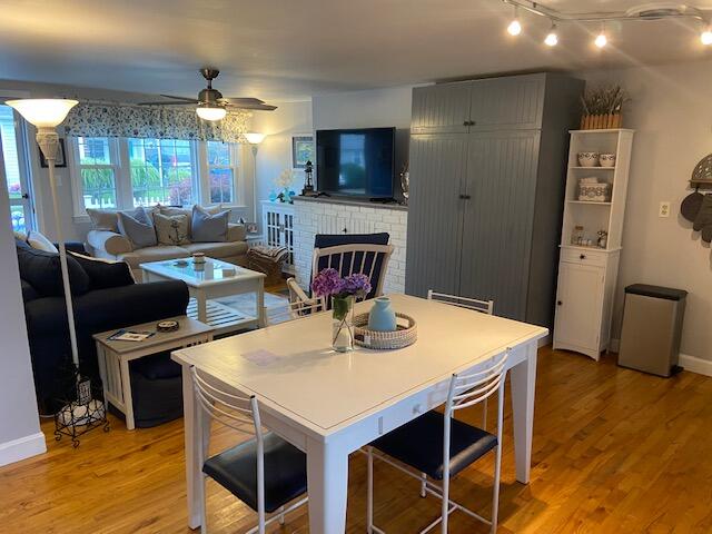 101 Lower County Road, Unit 2B Dennis Port, MA 02639 - Photo 18 of 28 a view of a dining room with furniture and wooden floor