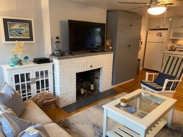 101 Lower County Road, Unit 2B Dennis Port, MA 02639 - Photo 20 of 28 a living room with furniture and a flat screen tv