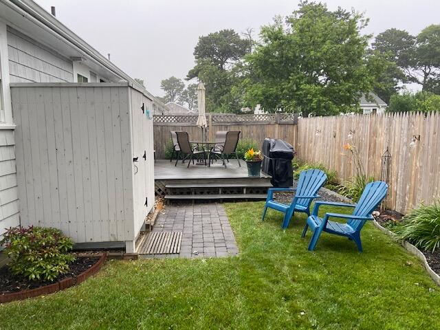 101 Lower County Road, Unit 2B Dennis Port, MA 02639 - Photo 27 of 28 a swimming pool with outdoor seating and yard