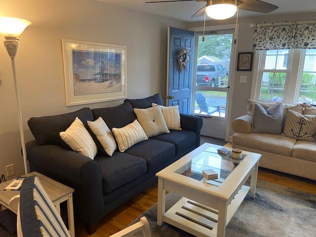 101 Lower County Road, Unit 2B Dennis Port, MA 02639 - Photo 4 of 28 a living room with furniture and a couch