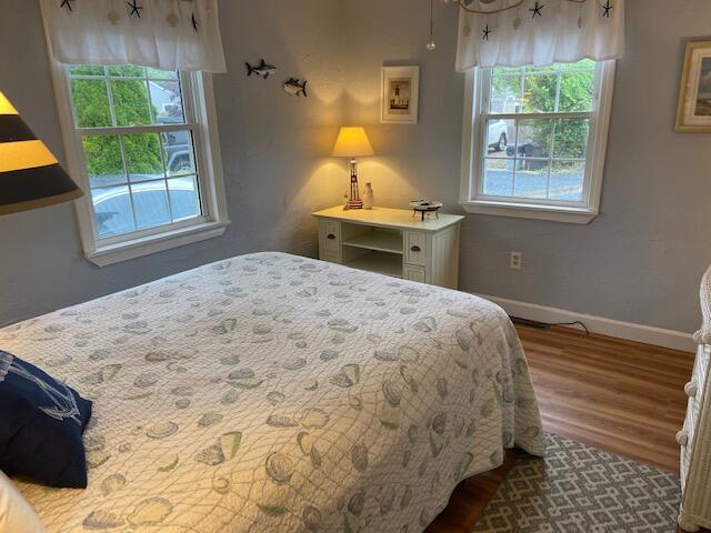101 Lower County Road, Unit 2B Dennis Port, MA 02639 - Photo 7 of 28 a bedroom with a bed and a window