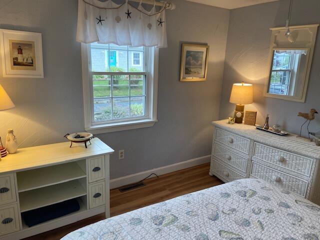 101 Lower County Road, Unit 2B Dennis Port, MA 02639 - Photo 8 of 28 a bedroom with a bed and a window