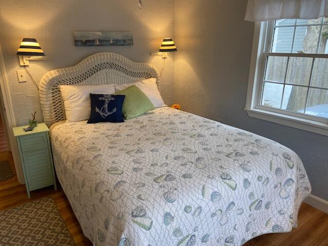 101 Lower County Road, Unit 2B Dennis Port, MA 02639 - Photo 9 of 28 a bedroom with a bed and a window