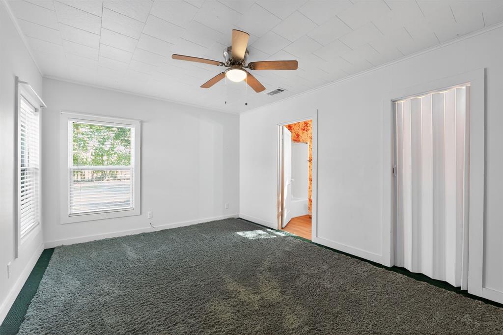 5485 Highway 7 Marlin, TX 76661 - Photo 24 of 36 Unfurnished bedroom featuring carpet floors, ceiling fan, and crown molding