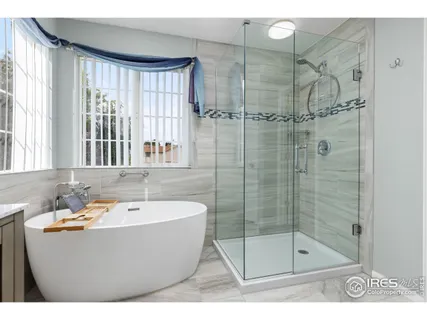 a bathroom with a bathtub and shower