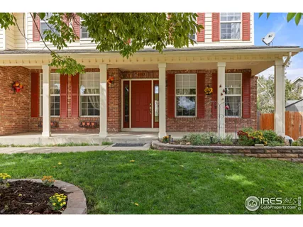 a view of a brick building with a yard