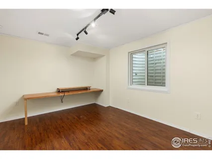 a view of room with stairs and wooden floor