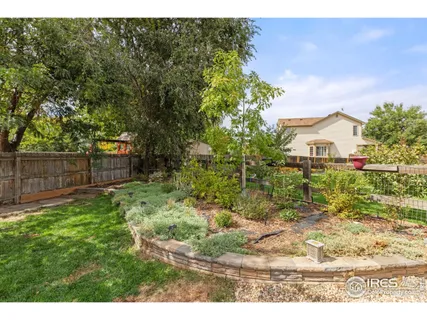 a back yard of a house with a yard