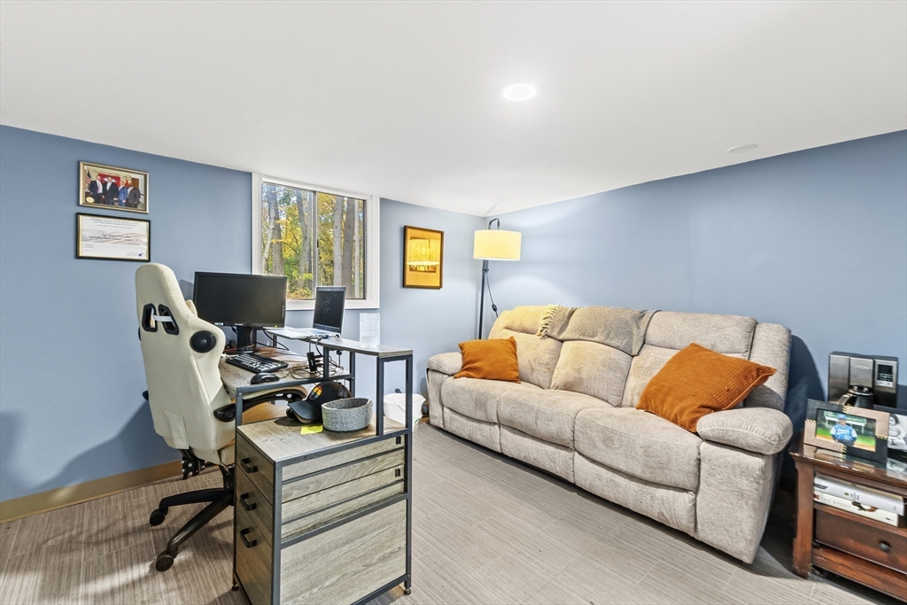 6 Tall Tree Road Sharon, MA 02067 - Photo 18 of 24 a living room with furniture and a flat screen tv