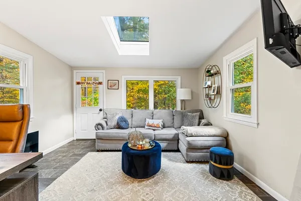 a living room with furniture and a window