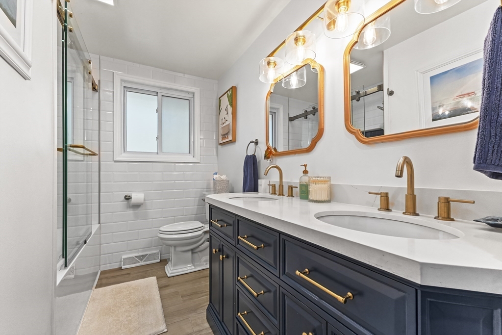 6 Tall Tree Road Sharon, MA 02067 - Photo 10 of 24 a bathroom with a double vanity sink mirror and toilet