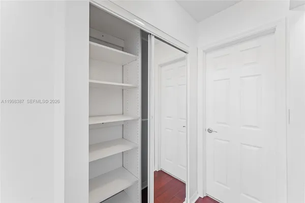 a bathroom with a granite countertop sink and a bathtub