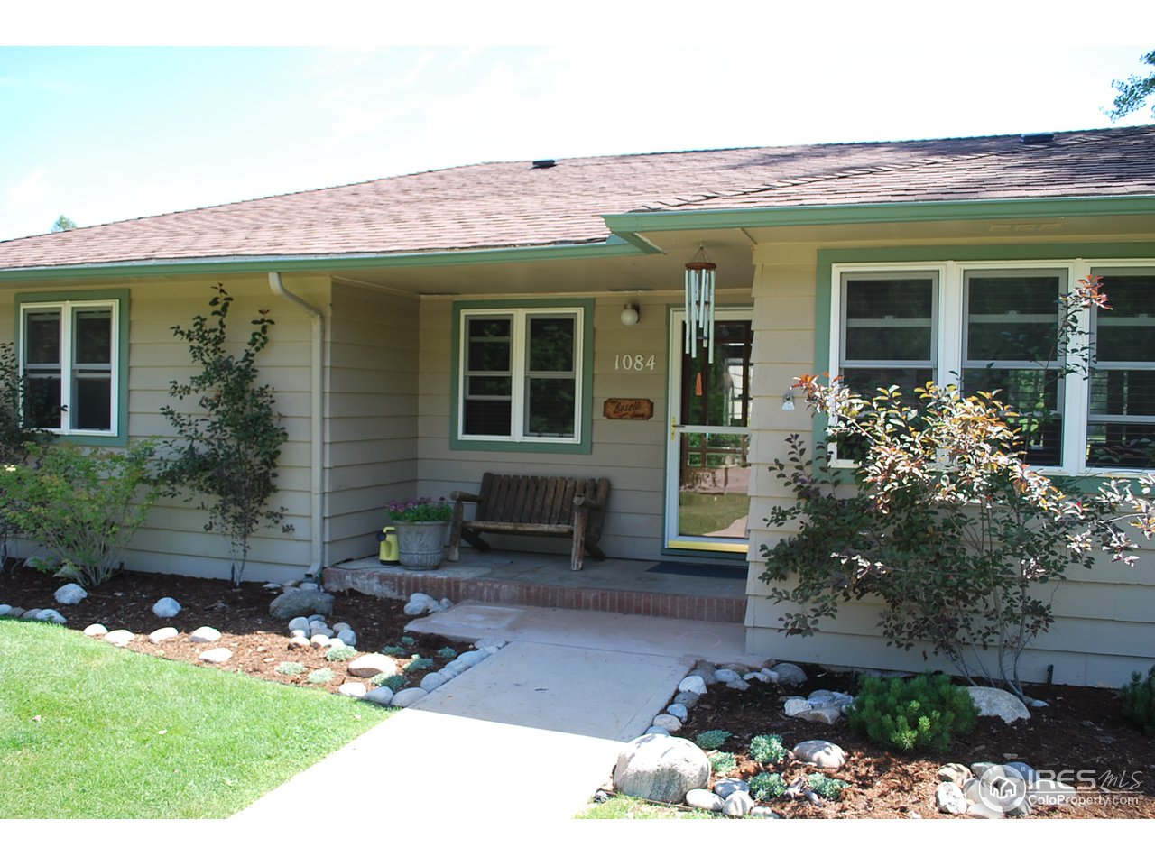 1084 Gapter Road Boulder, CO 80303 - Photo 1 of 25 a front view of a house with garden