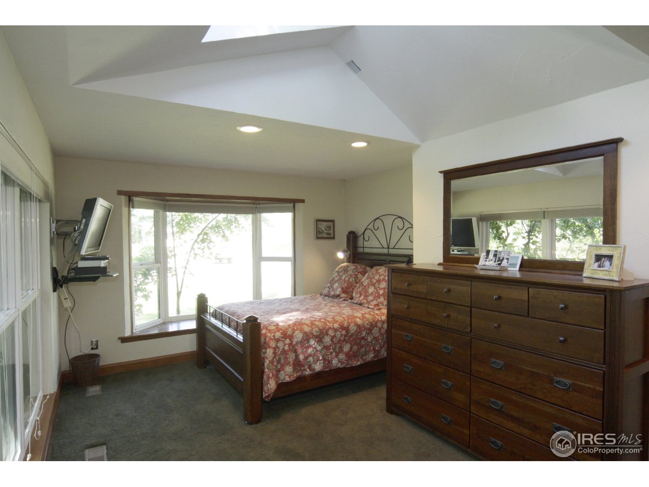 1084 Gapter Road Boulder, CO 80303 - Photo 11 of 25 a bedroom with a bed and a large window