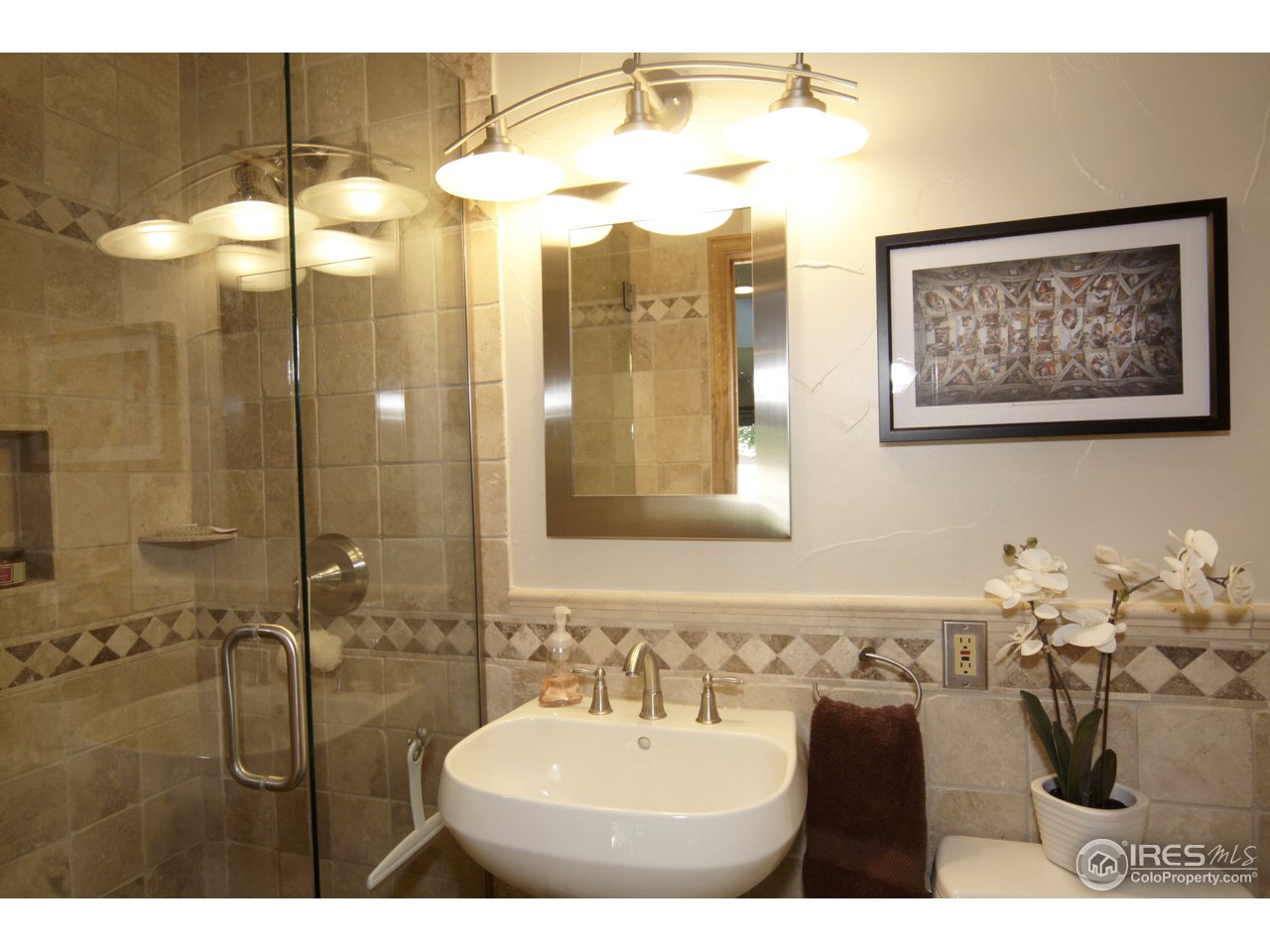 1084 Gapter Road Boulder, CO 80303 - Photo 12 of 25 a bathroom with a sink and a mirror