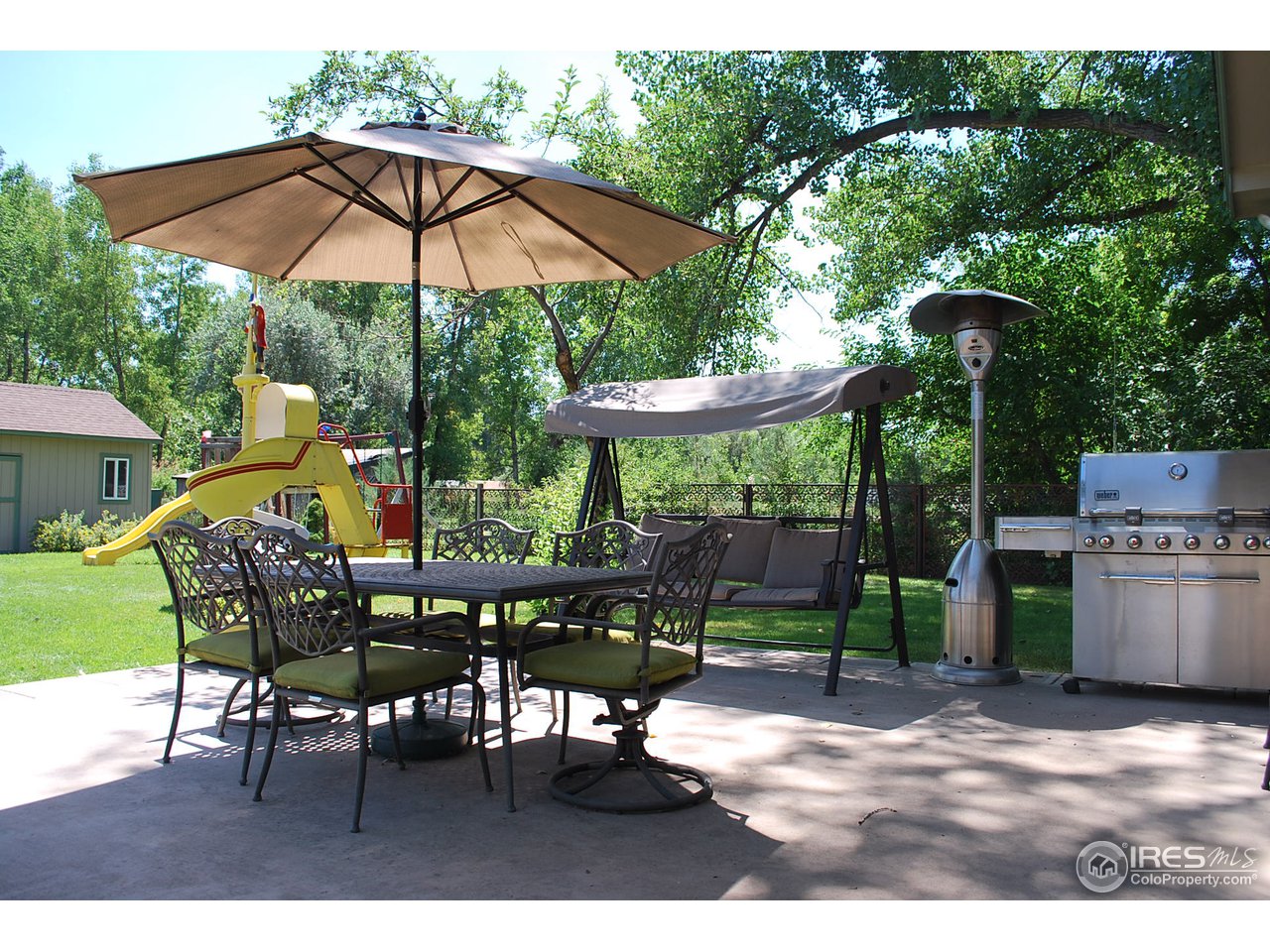 1084 Gapter Road Boulder, CO 80303 - Photo 18 of 25 a view of a table and chairs under an umbrella in the patio