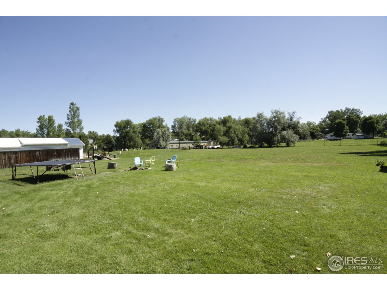 1084 Gapter Road Boulder, CO 80303 - Photo 23 of 25 a backyard of a house with lots of green space
