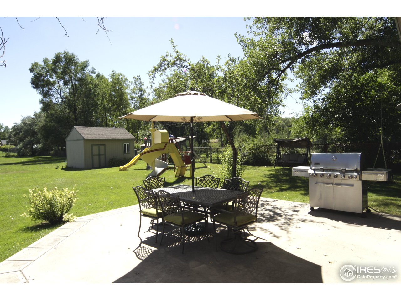 1084 Gapter Road Boulder, CO 80303 - Photo 24 of 25 a backyard of a house with table and chairs