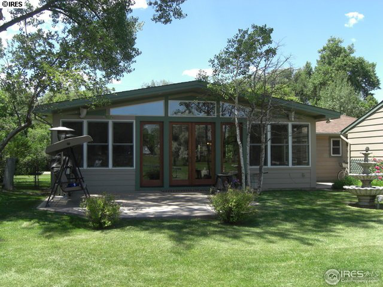 1084 Gapter Road Boulder, CO 80303 - Photo 25 of 25 a view of a house with backyard garden and sitting area