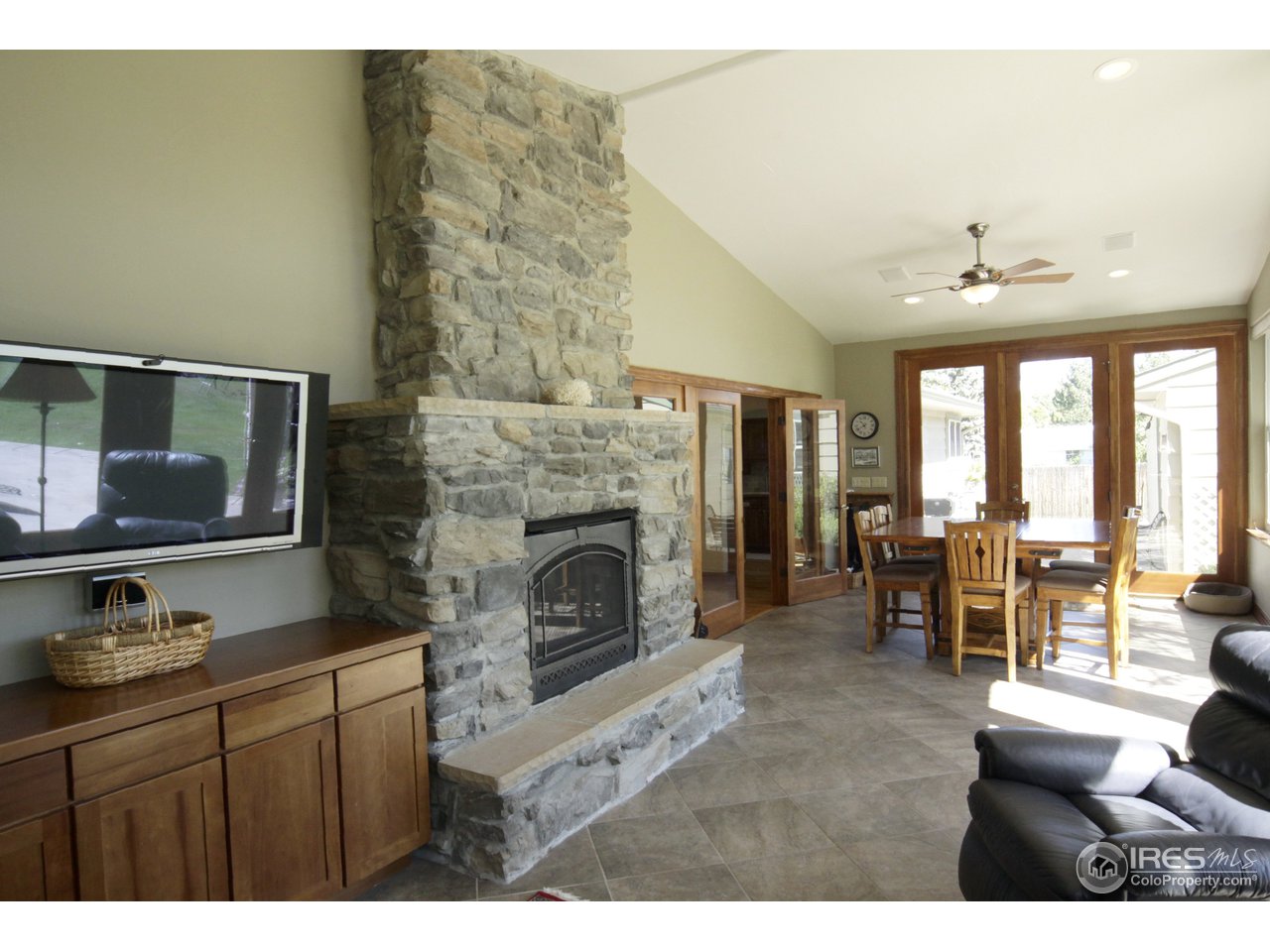 1084 Gapter Road Boulder, CO 80303 - Photo 3 of 25 a living room with furniture a fireplace and a large window