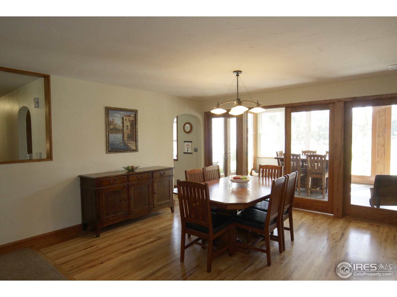 1084 Gapter Road Boulder, CO 80303 - Photo 6 of 25 a view of a dining room with furniture window and wooden floor