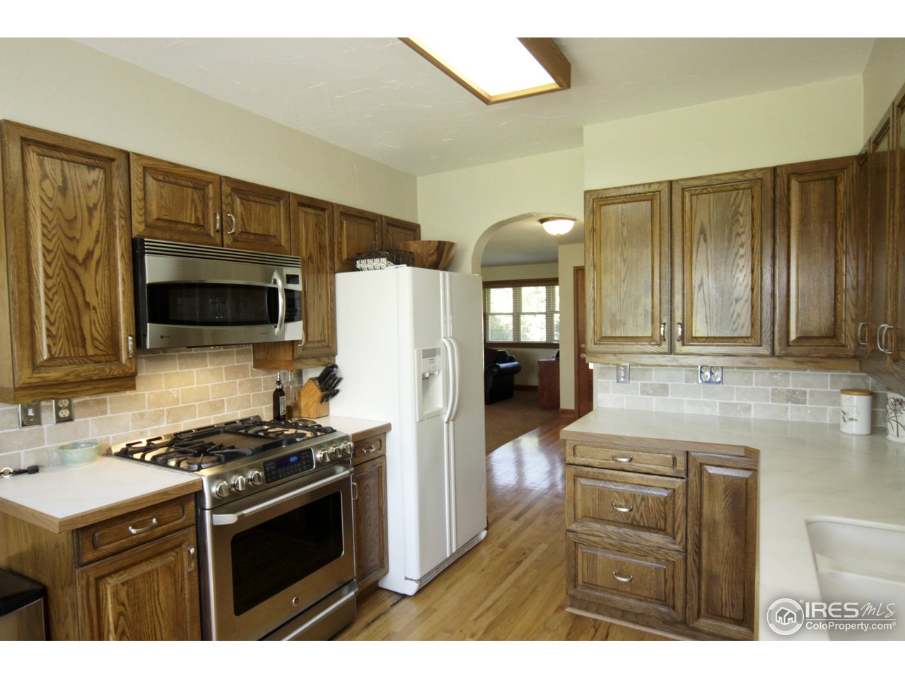 1084 Gapter Road Boulder, CO 80303 - Photo 8 of 25 a kitchen with stainless steel appliances a stove microwave and refrigerator
