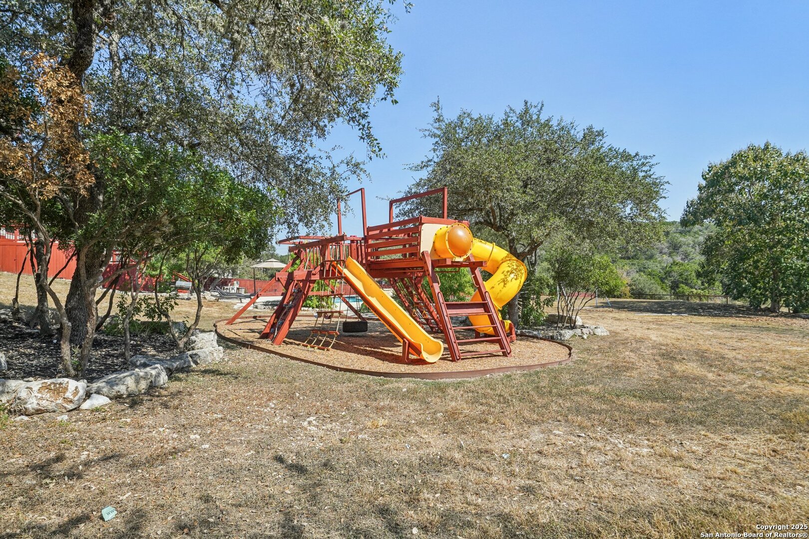 718 Ruidosa Downs Helotes, TX 78023 - Photo 5 of 50 a view of a park with slide