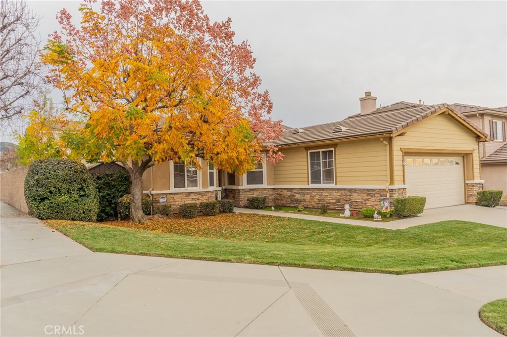 11555 Townsend Way Yucaipa, CA 92399 - Photo 1 of 47 a front view of a house with a yard