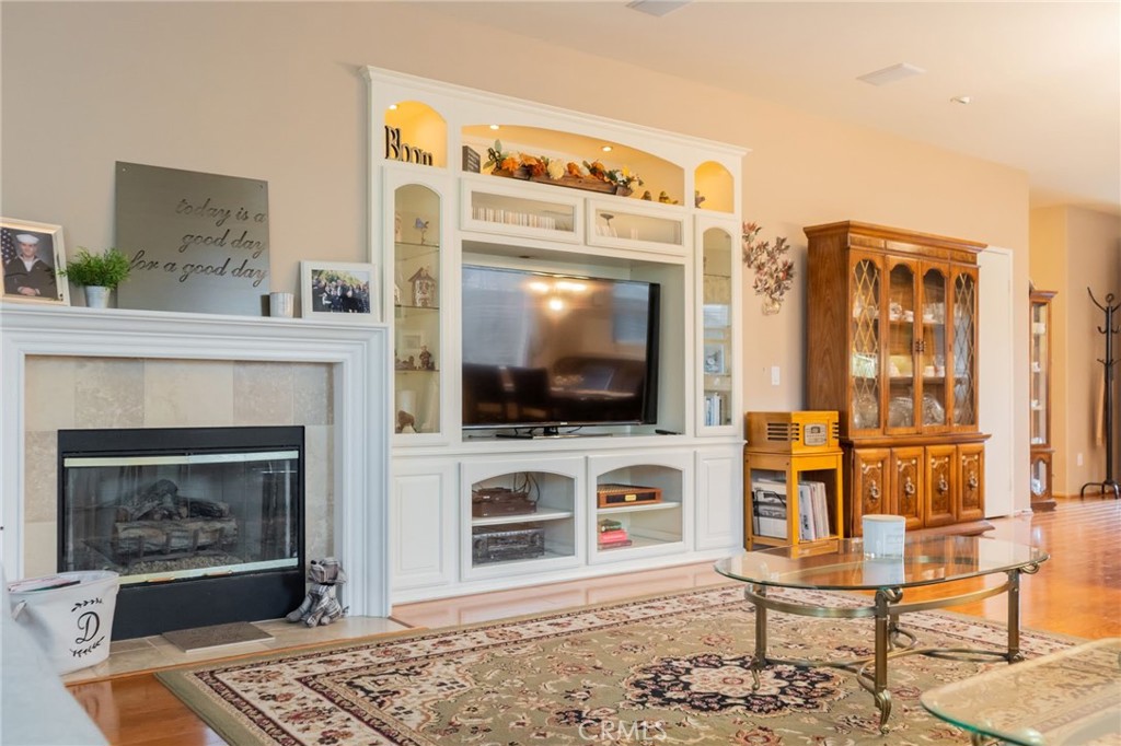 11555 Townsend Way Yucaipa, CA 92399 - Photo 20 of 47 a living room with furniture a flat screen tv and a fireplace