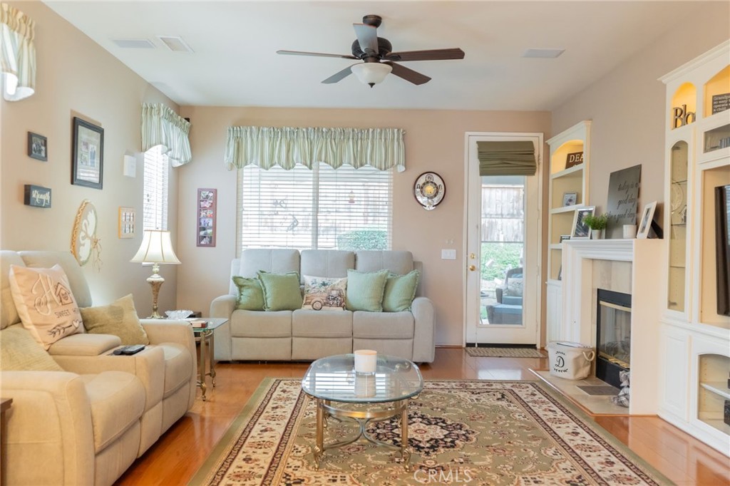11555 Townsend Way Yucaipa, CA 92399 - Photo 23 of 47 a living room with furniture and a fireplace