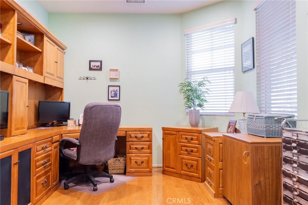 11555 Townsend Way Yucaipa, CA 92399 - Photo 24 of 47 a view of a workspace with furniture and a window