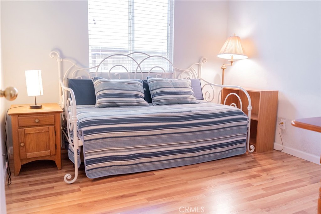 11555 Townsend Way Yucaipa, CA 92399 - Photo 28 of 47 a bedroom with a bed and a dresser