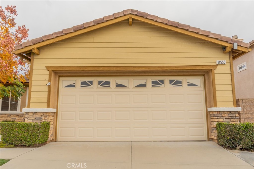 11555 Townsend Way Yucaipa, CA 92399 - Photo 3 of 47 a front view of a house with garage