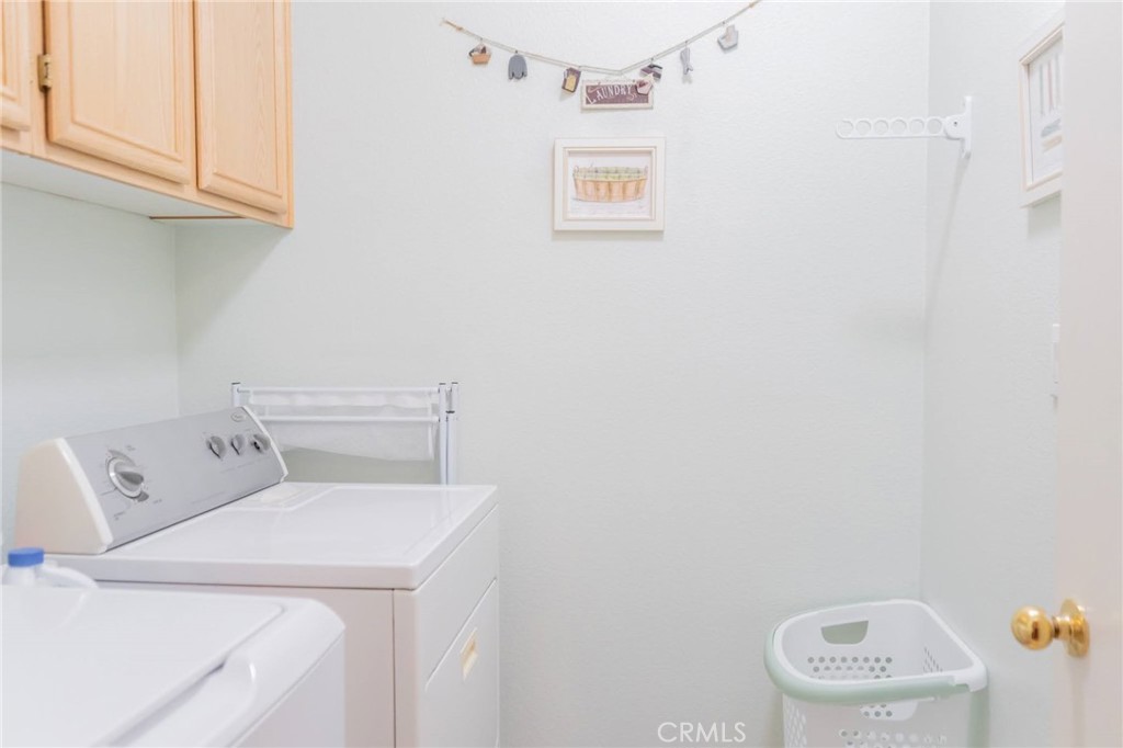 11555 Townsend Way Yucaipa, CA 92399 - Photo 31 of 47 a utility room with dryer and washer
