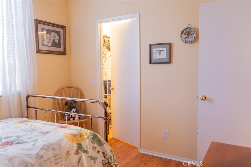 11555 Townsend Way Yucaipa, CA 92399 - Photo 32 of 47 a bedroom with a bed and cupboard