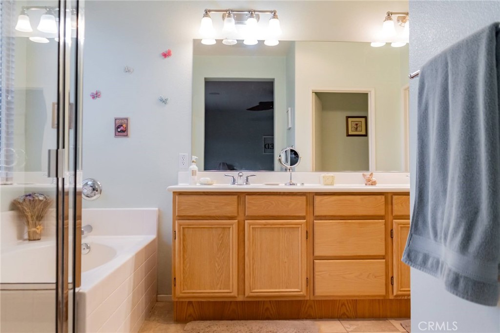 11555 Townsend Way Yucaipa, CA 92399 - Photo 35 of 47 a bathroom with a sink and a mirror