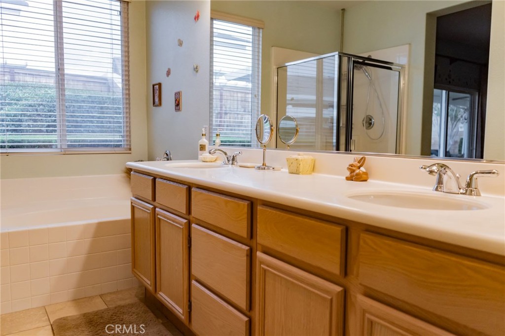 11555 Townsend Way Yucaipa, CA 92399 - Photo 37 of 47 a bathroom with a sink and a mirror