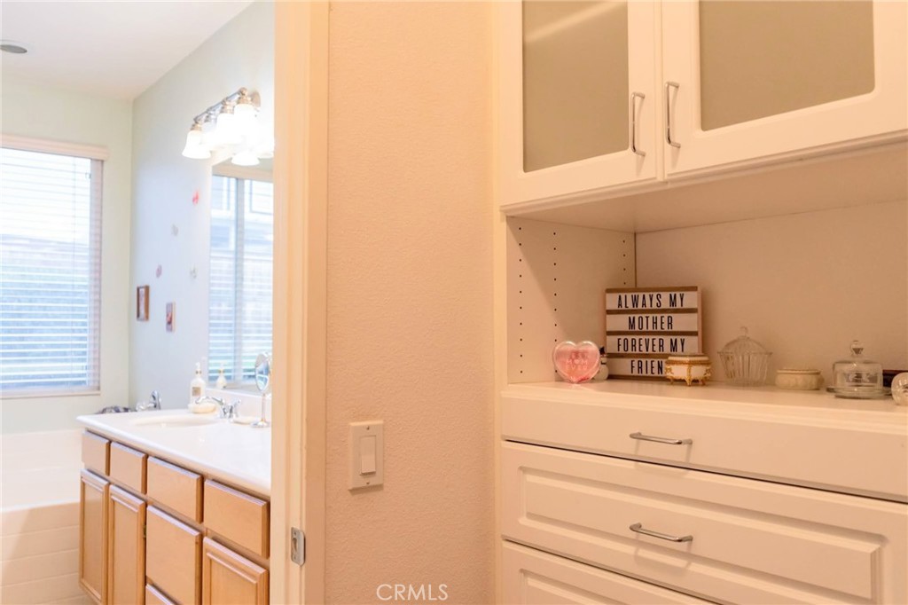 11555 Townsend Way Yucaipa, CA 92399 - Photo 38 of 47 a bathroom with a sink and a mirror
