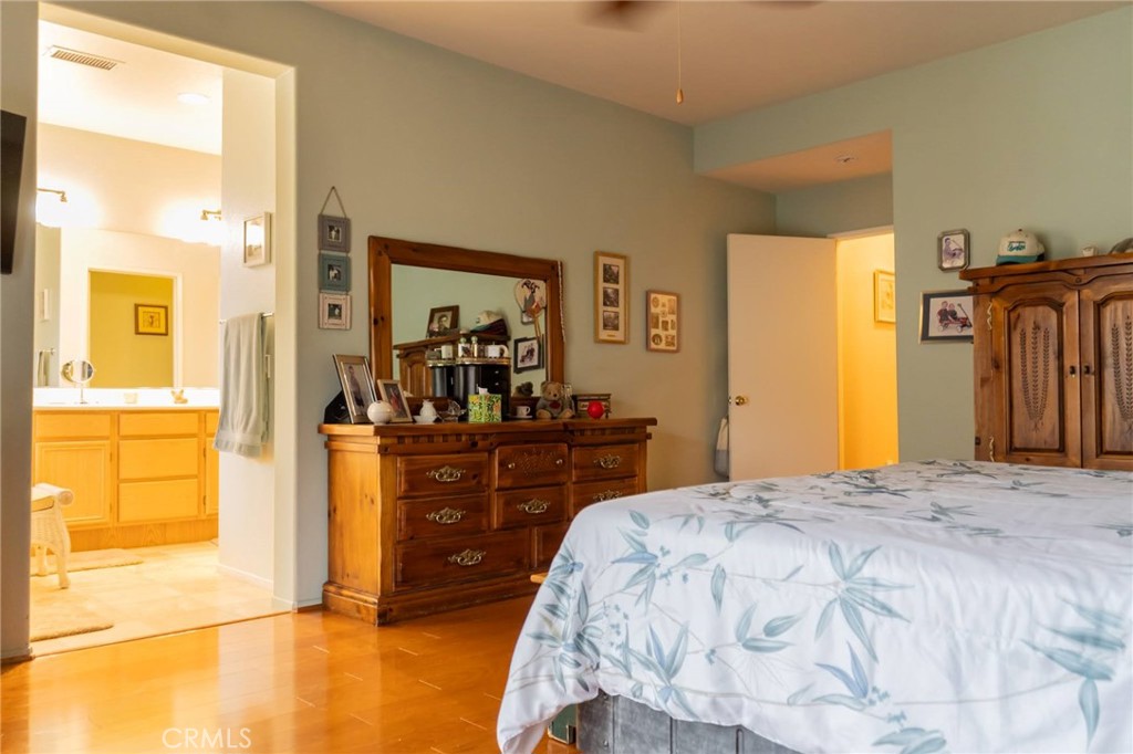 11555 Townsend Way Yucaipa, CA 92399 - Photo 40 of 47 a bedroom with a bed and a dresser