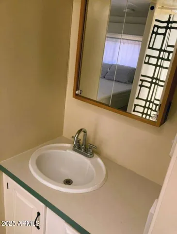 a bedroom with a bed and walk in closet