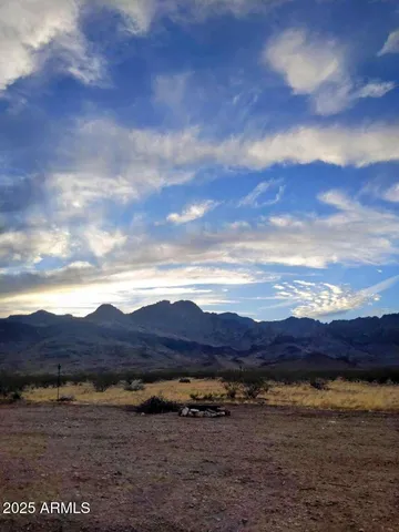 a view of an ocean and mountain