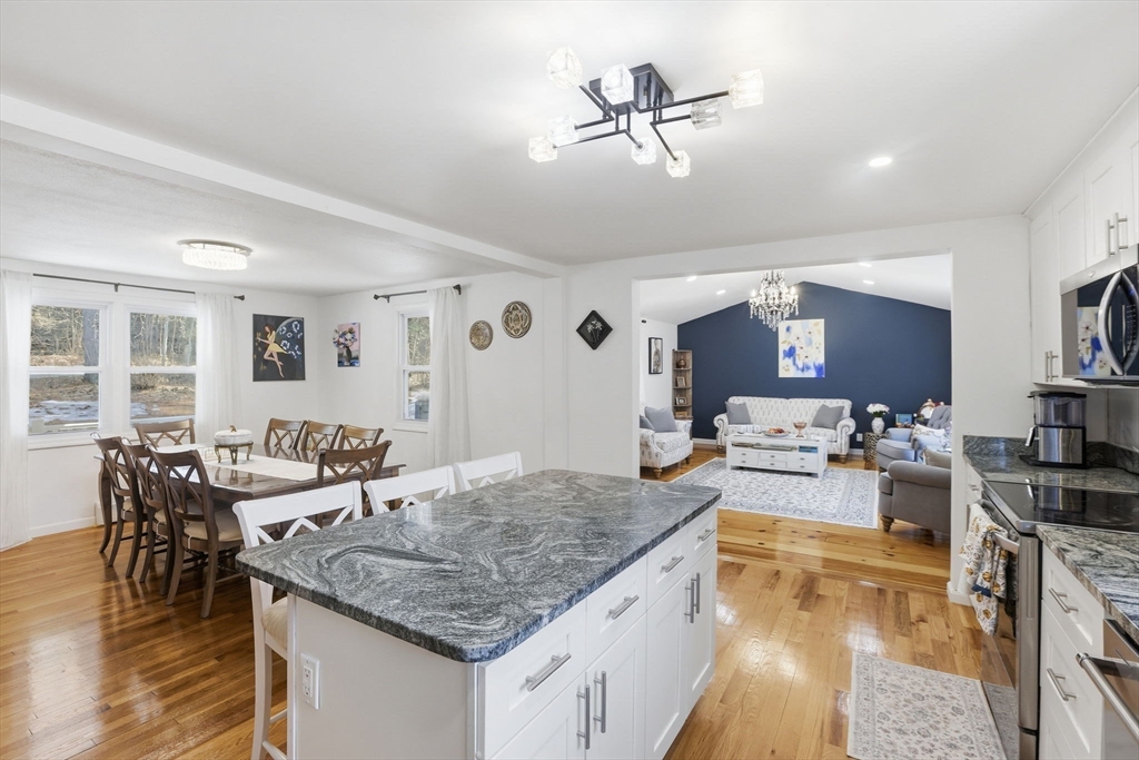 97 Chicopee Row Groton, MA 01450 - Photo 12 of 41 a kitchen with lots of counter top space and furniture