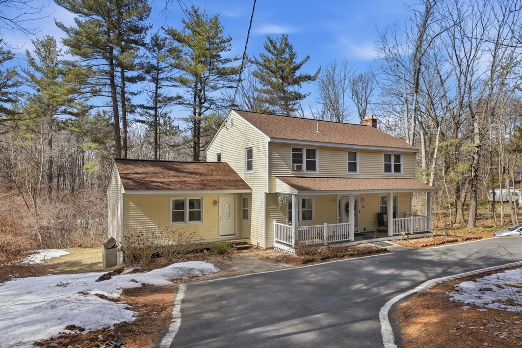 97 Chicopee Row Groton, MA 01450 - Photo 2 of 41 front view of a house with a rug